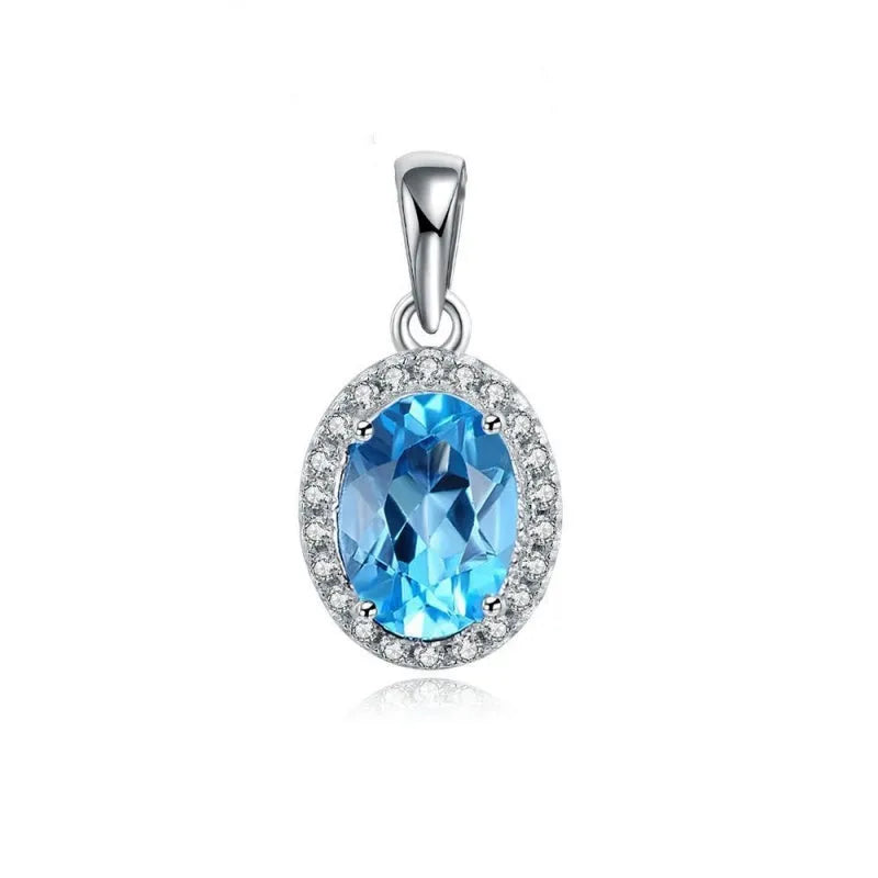 925 sterling silver jewellery set with blue topaz gems in geometric design including earrings, ring, necklace and pendant