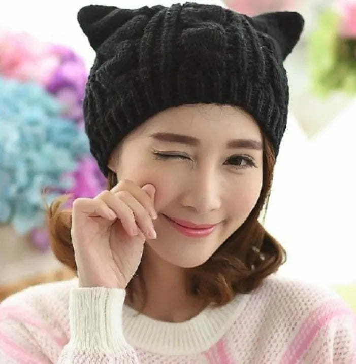 Hand-knitted cat ear winter beanie in red wool with 3D design