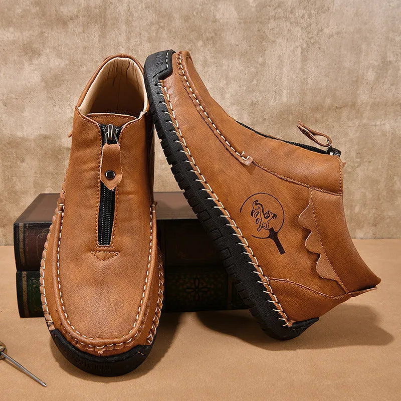 Men's leather slip-on loafers in black brown or grey colours showing round toe and rubber sole design