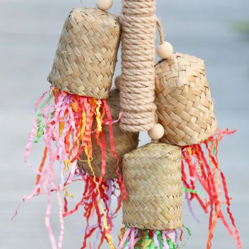 Colourful shredded paper parrot toy with wood and sisal construction hanging