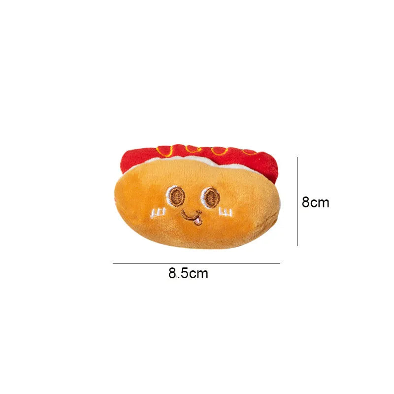 Set of four soft fabric cat chew toys shaped like a hamburger, chicken leg, fries, and hot dog on a plain background.