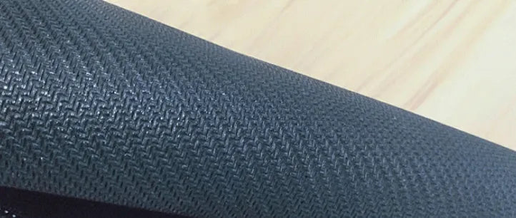 Large natural rubber computer desk pad with non-slip backing showing one of seven pattern options
