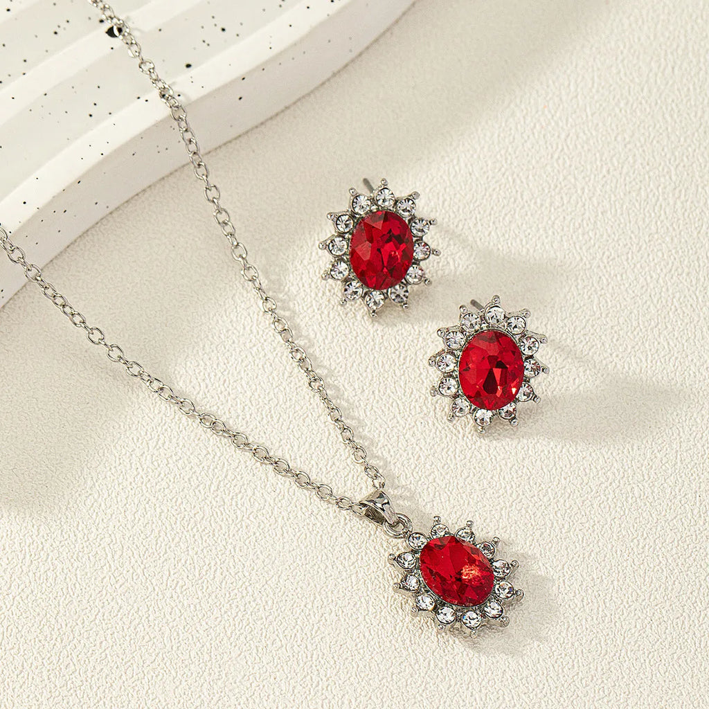 Women's sunflower motif alloy earring and necklace jewellery set in six colour options.