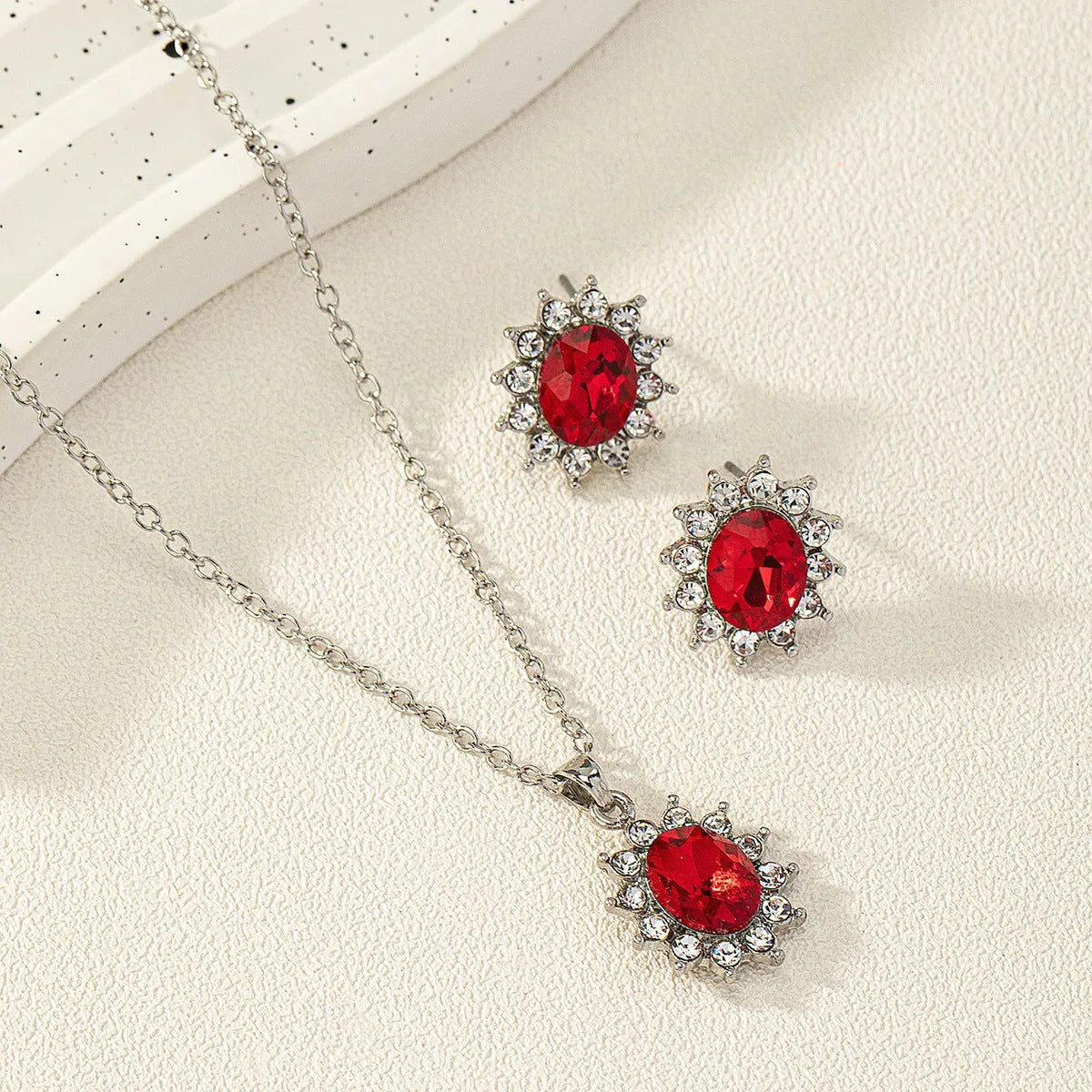 Women's sunflower motif alloy earring and necklace jewellery set in six colour options.