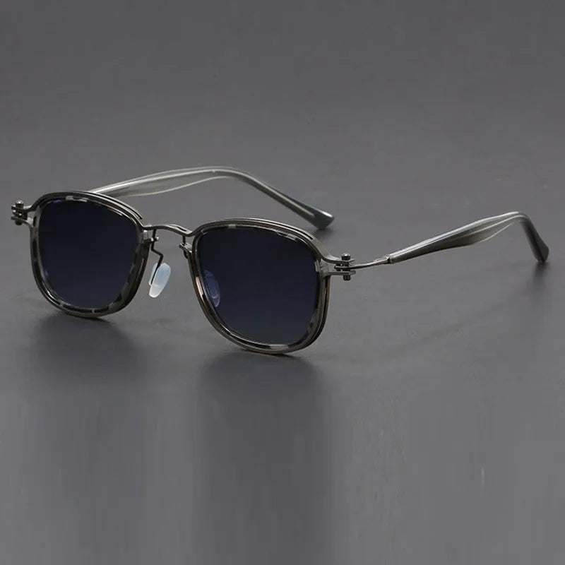 Retro square frame sunglasses with AC lenses in a black gold and grey colour combination.