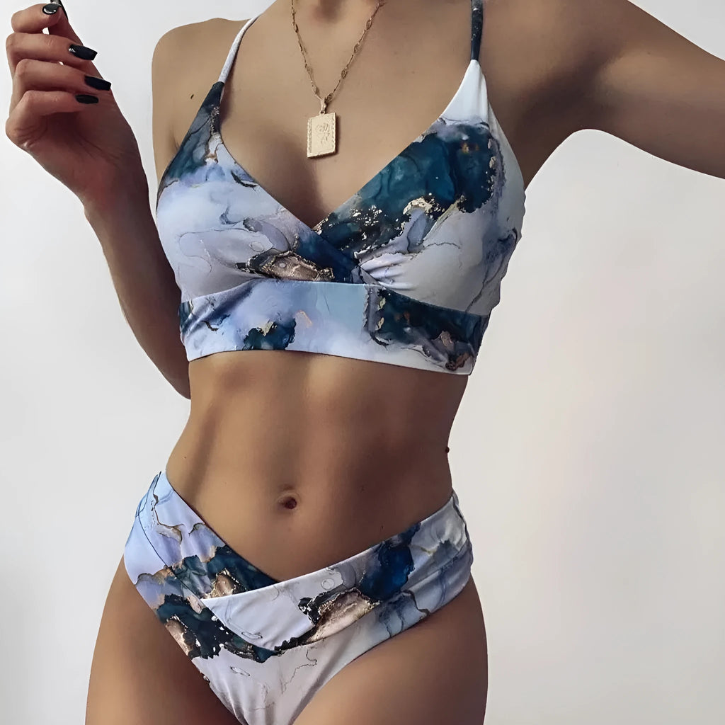 Women's high-waisted bikini set with marble tie-dye print and U-neck top