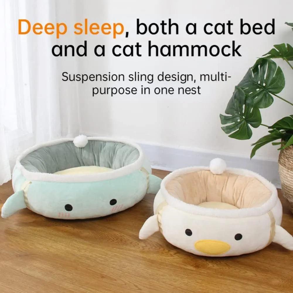 Green dinosaur shaped cat bed with hanging straps shown both flat and as hammock