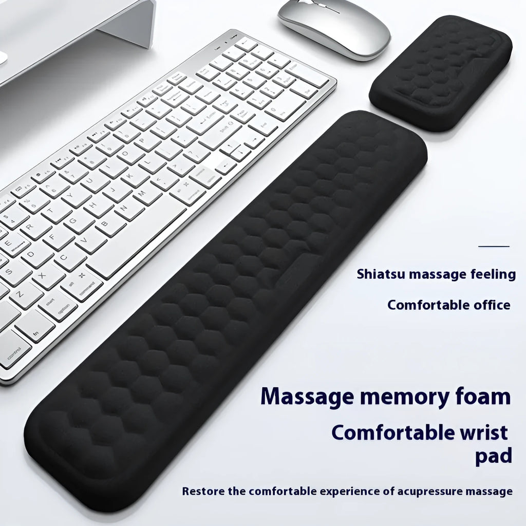 Grey and black memory cotton mouse wrist pads in cloth and leather styles on a desk.