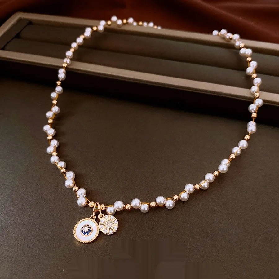 Gold electroplated zircon pearl pendant necklace on adjustable clavicle chain