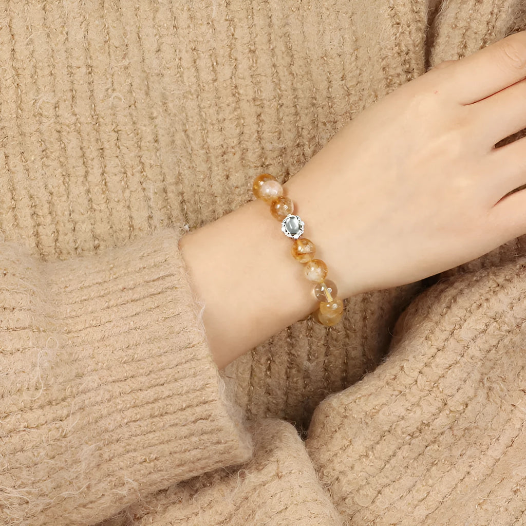 Geometric citrine crystal bracelet with 10mm polished stones on wrist