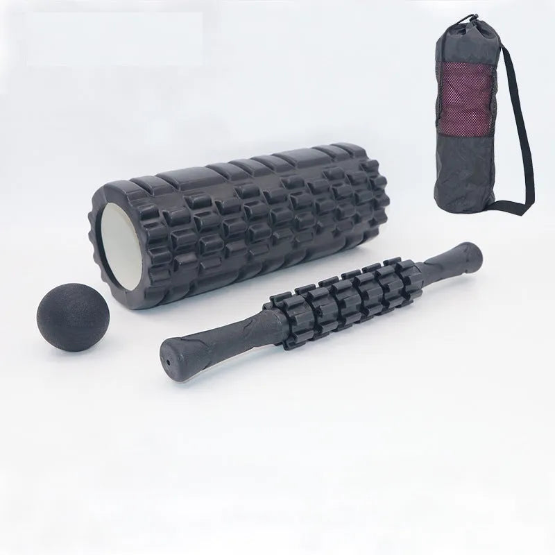 Black 33cm long fitness foam roller with six segmented pieces on a plain background.