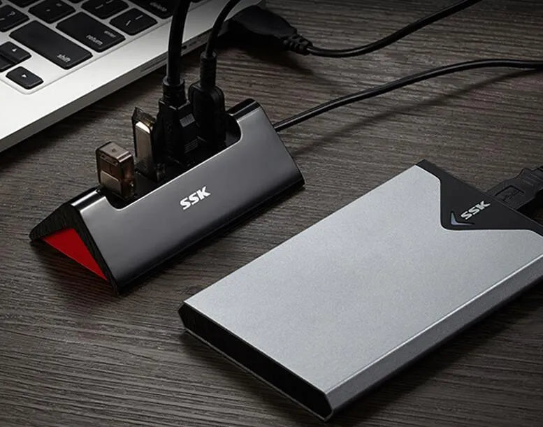 Black USB expansion dock with four ports and ABS construction measuring 100mm long
