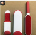 Blue reusable pet hair removal comb with a large double-sided sticky brush and a self-cleaning base unit.