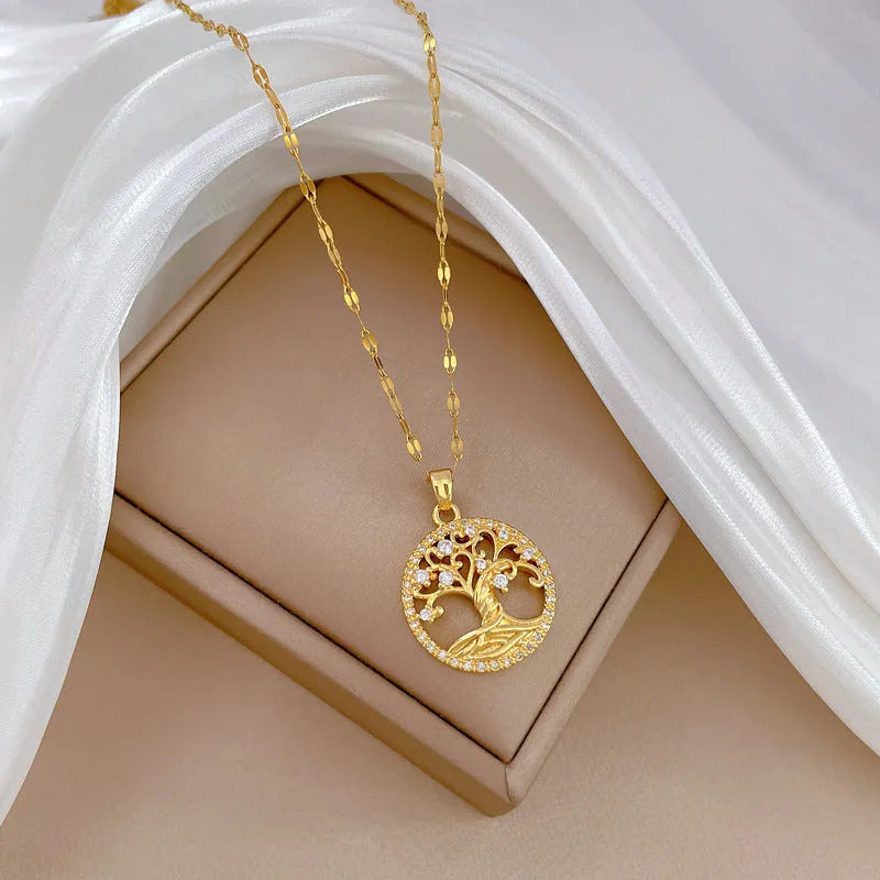 Gold-plated cross necklace with mother-of-pearl pendant and rhinestone detailing on adjustable chain