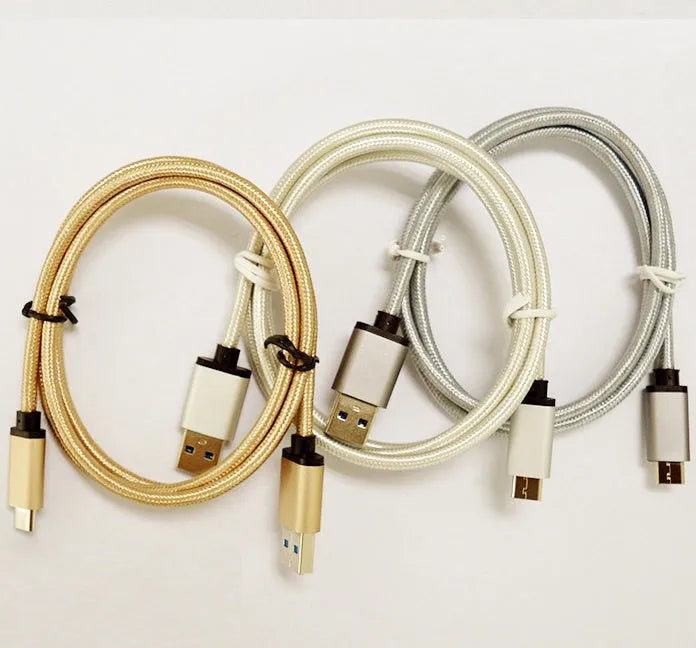 USB-C to USB-A charging and data cable with metal housing in gold colour