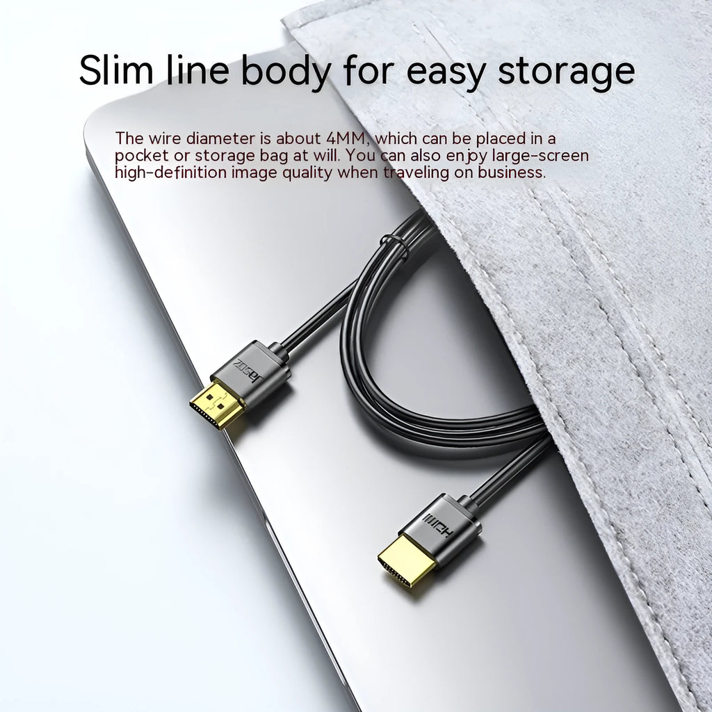 A thin, flexible HDMI cable with gold-plated connectors on a white background.
