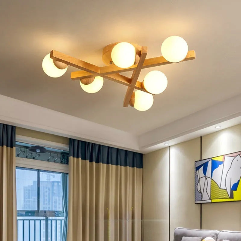 Wooden style circular ceiling lamp with three pendant lights in a Nordic design