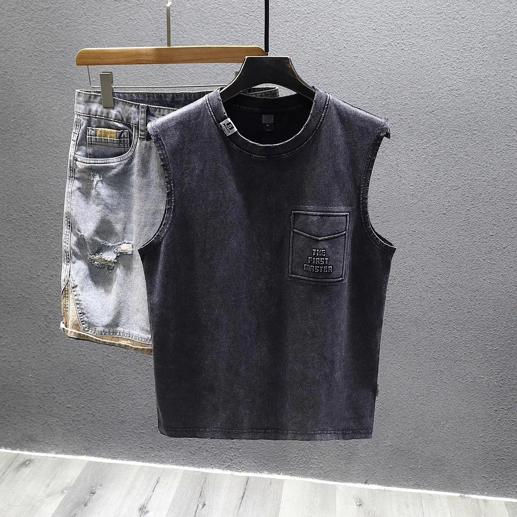 Men's solid black loose-fit cotton sleeveless t-shirt with a straight hem on a white background.