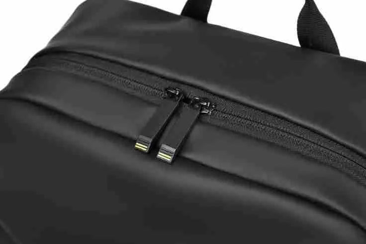 Waterproof PU leather laptop backpack in black, blue, and grey colour options