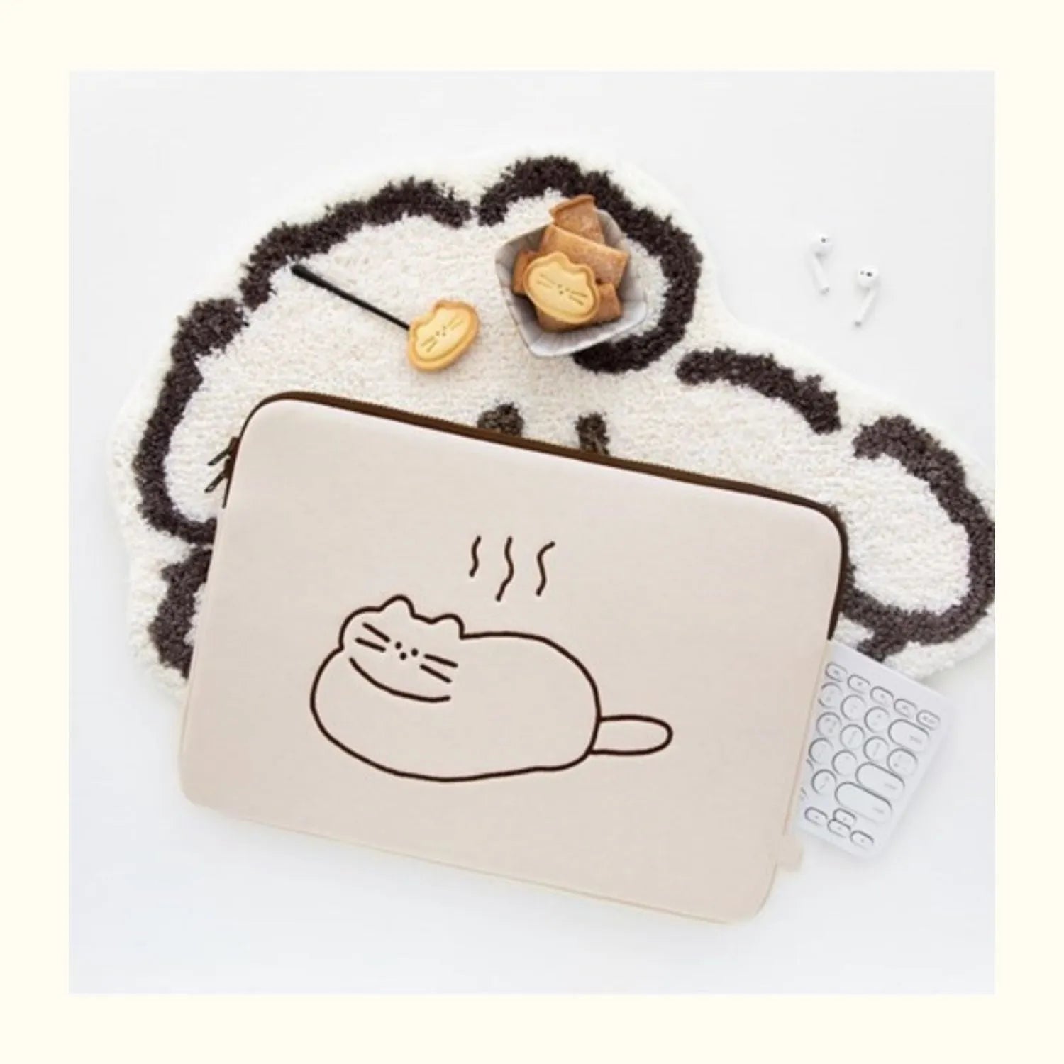 Embroidered laptop sleeve with animal design showing polyester construction and laptop size compatibility