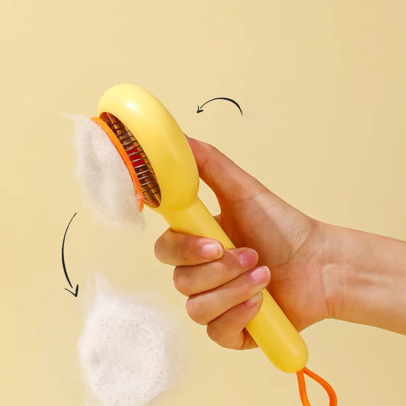Small yellow cat grooming comb with needle teeth and floating hair removal device