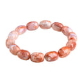 Natural cherry agate bracelet with geometric barrel beads and a Ruyi design detail.