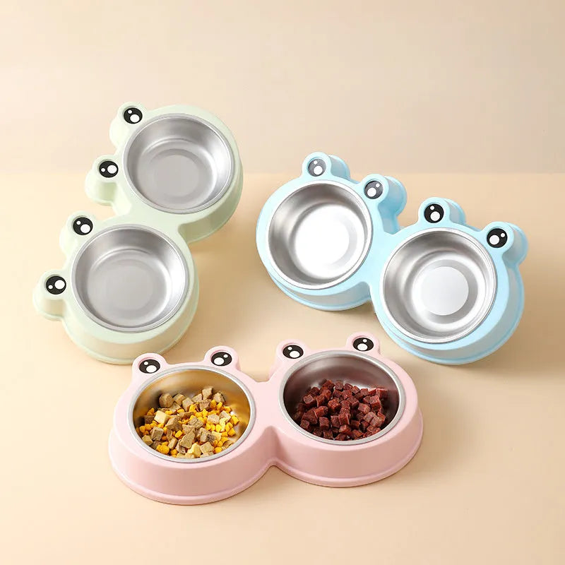 Stainless steel double pet bowl with frog-shaped non-slip base in blue, green, and pink colours