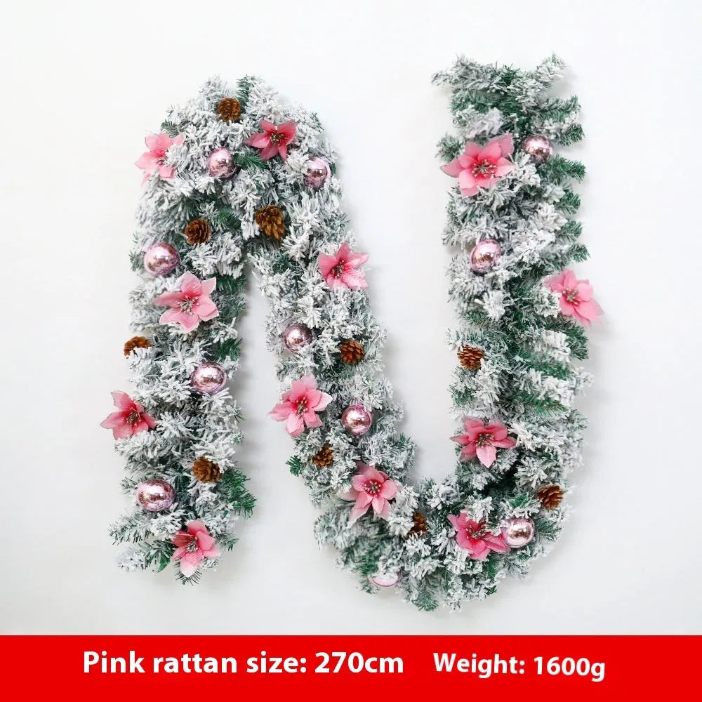 Flocked PVC rattan vine Christmas garland decoration in a festive colour, draped over a mantelpiece.