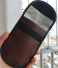 Black microfiber Faraday cage bag for blocking key fob and card signals, shown with dimensions 13.5cm by 9.5cm.