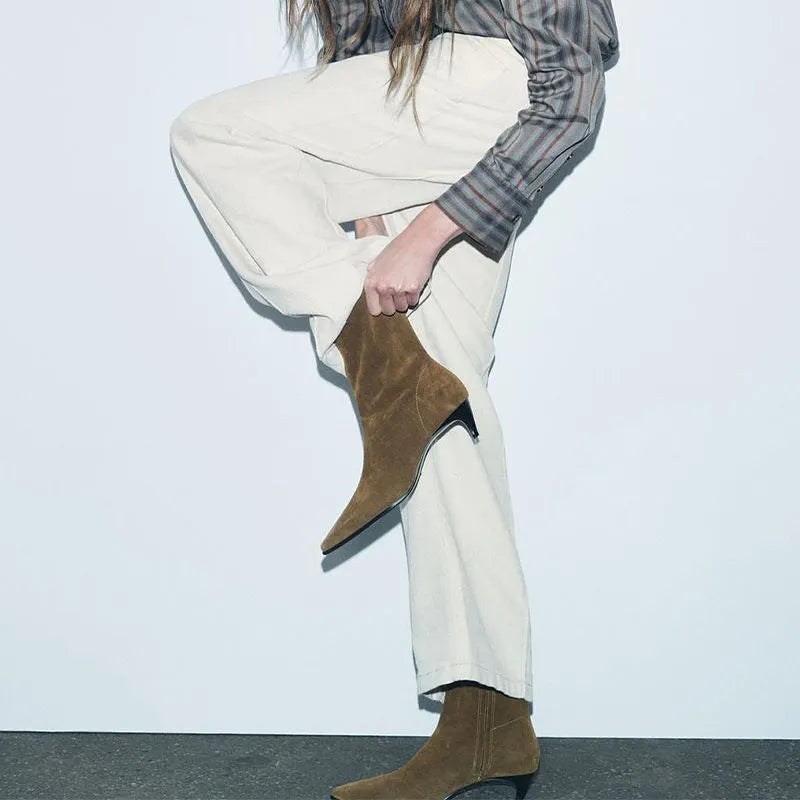 Brown women's square toe ankle boots with a side zipper and a mid-height kitten heel on a waterproof platform.
