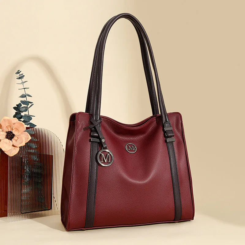 Women's large horizontal square PU leather crossbody bag in wine red colour.