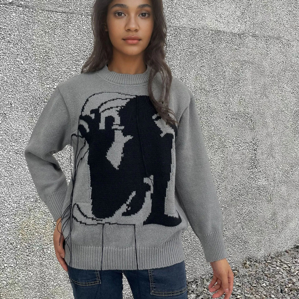 Women's grey alpaca wool sweater with abstract pattern and tassel design on front