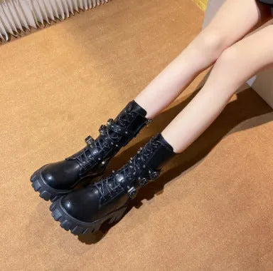 Black women's mid-calf knight boots with metal buckle and side zipper on a round toe.