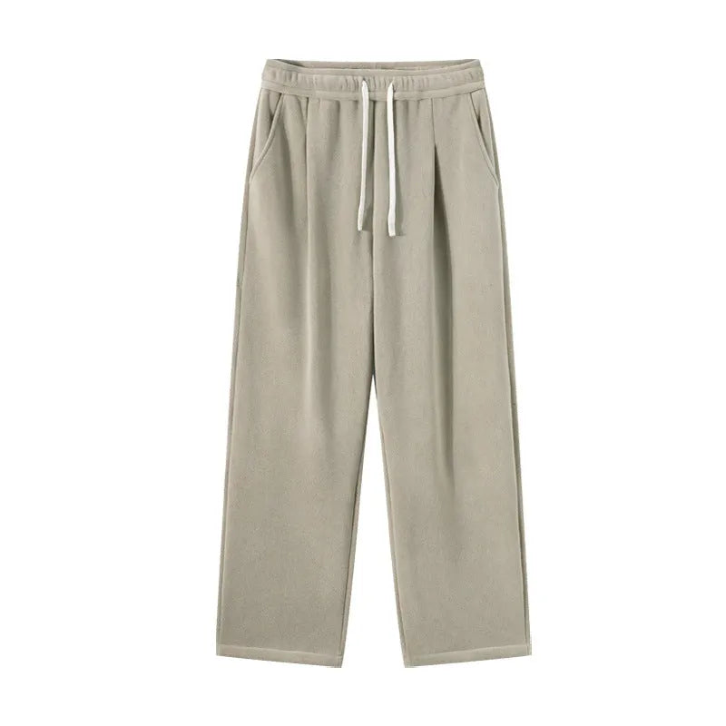 Men's apricot coloured fleece-lined loose fit sports trousers with an elasticated drawstring waist.