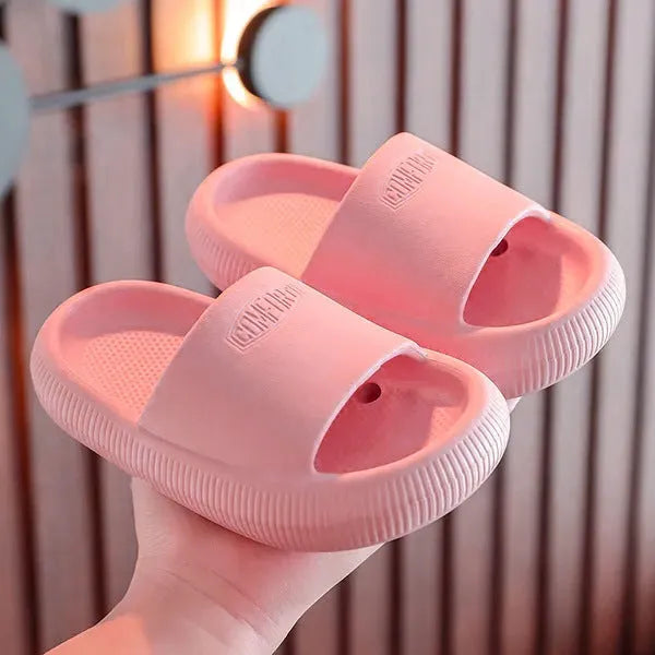 Brightly coloured children's EVA slippers with a textured non-slip sole, shown in multiple colour options.