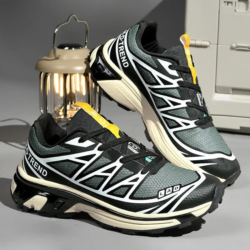 Men's and women's low-top black and grey hiking shoes with rubber sole and lace-up front.