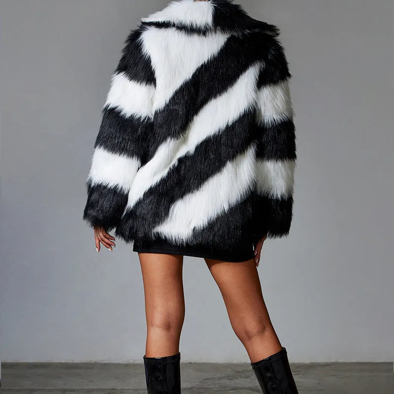 Women's faux fur coat with contrasting colour lapels and a fur collar.