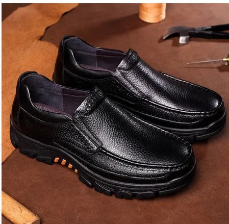 Business casual leather slip-on shoes in black and brown colours showing rubber sole and professional design