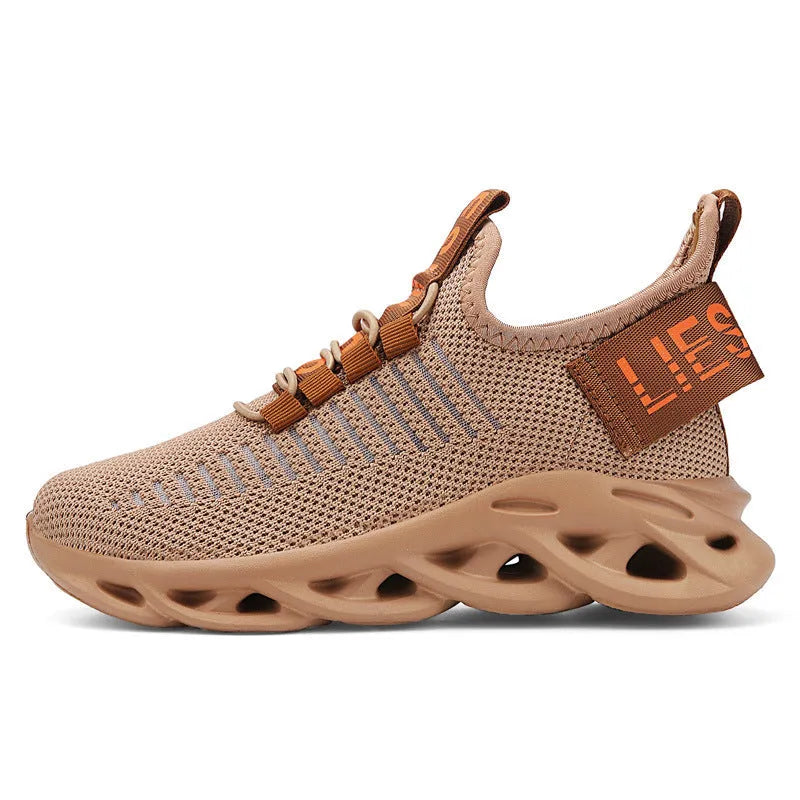 Children's fabric sneakers with Velcro strap in black, khaki, and white colours on a neutral background.
