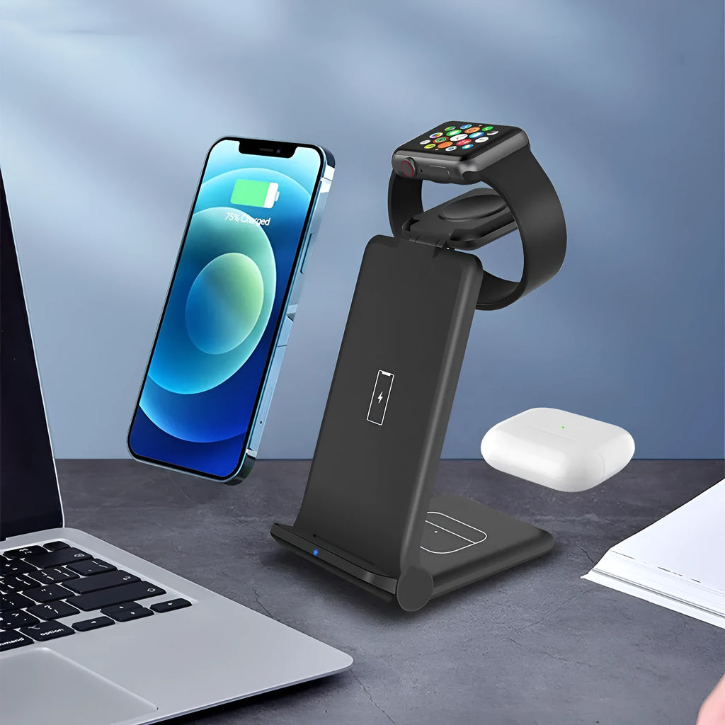 White 3-in-1 foldable wireless charging station charging an iPhone, Apple Watch, and AirPods case on a desk.