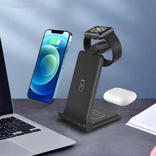 White 3-in-1 foldable wireless charging station charging an iPhone, Apple Watch, and AirPods case on a desk.