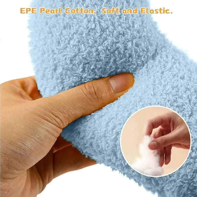 Small U-shaped plush pillow for cats and small dogs in blue colour, showing quilted faux fur texture.
