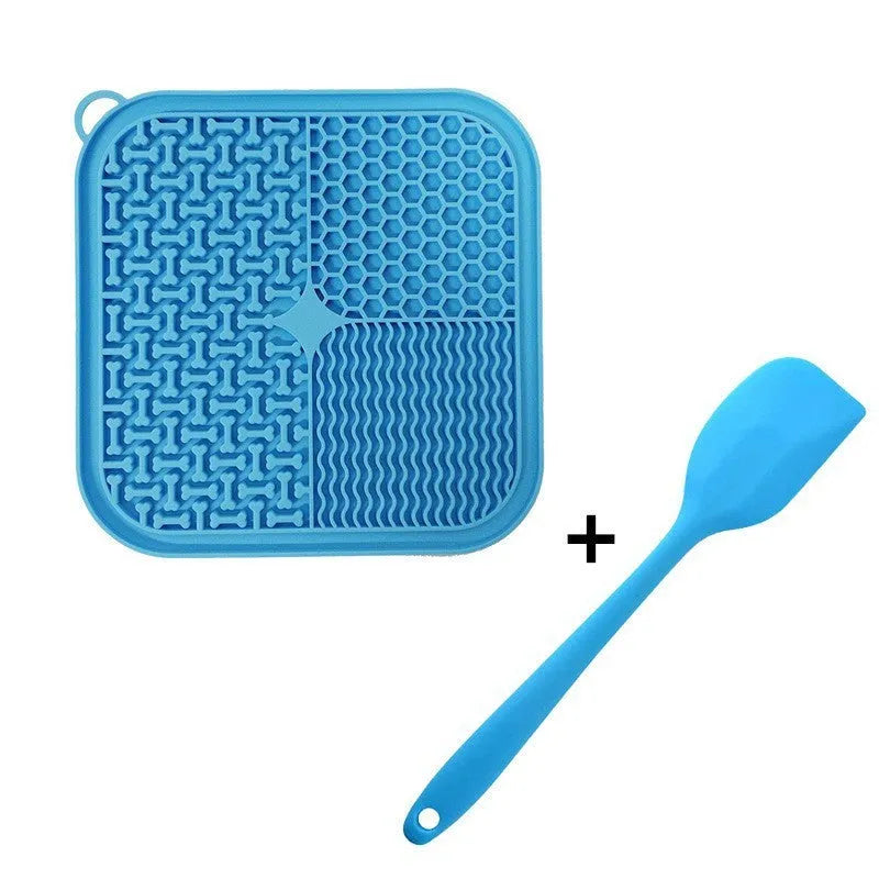 Square orange silicone dog licking mat with suction cups on back and textured surface