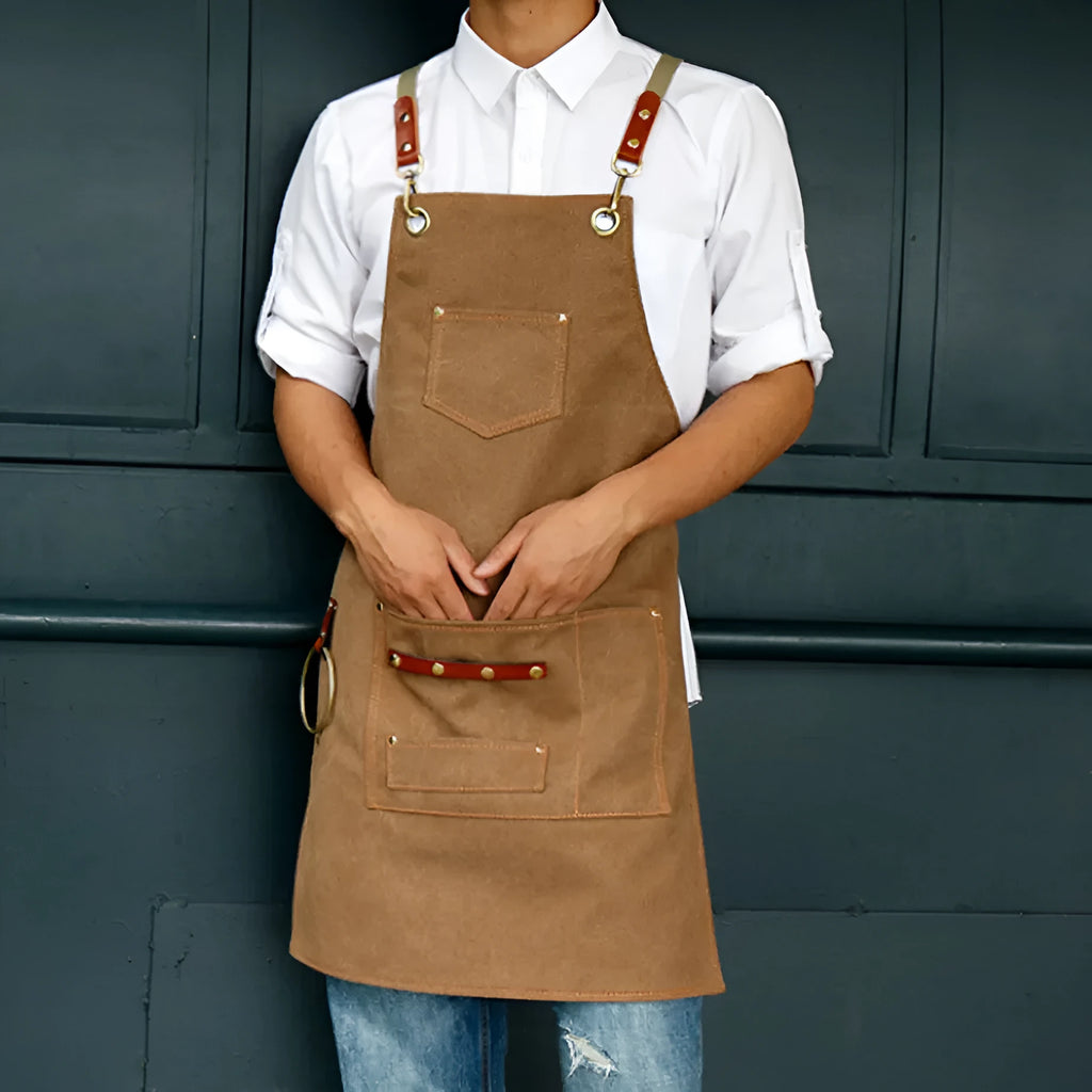 Canvas apron with cross-strap back design in camel colour for work protection