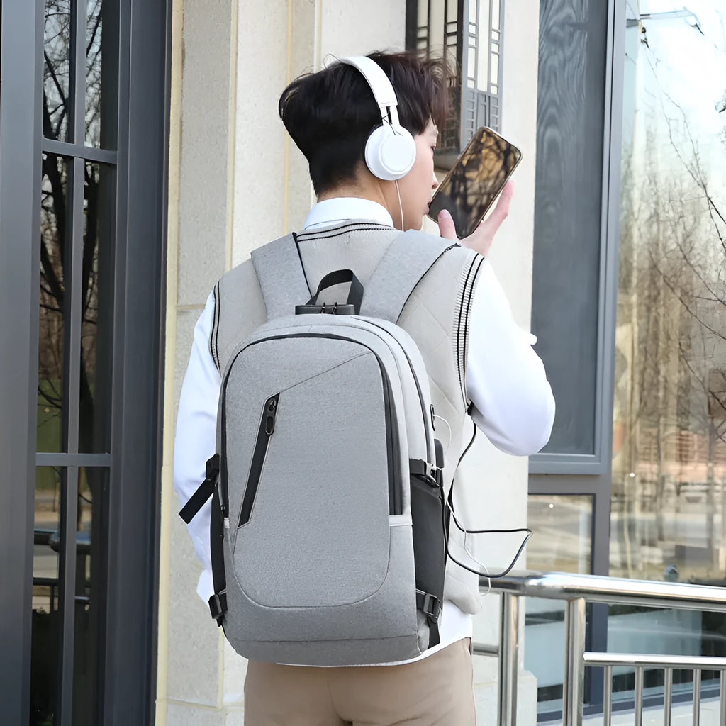 Oxford cloth computer backpack in blue colour showing front storage compartment and adjustable shoulder straps