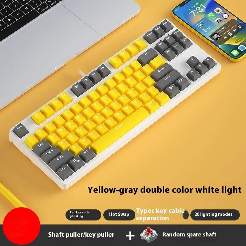 87 key wired mechanical keyboard with metal chassis shown in a black, orange, and yellow colour configuration.