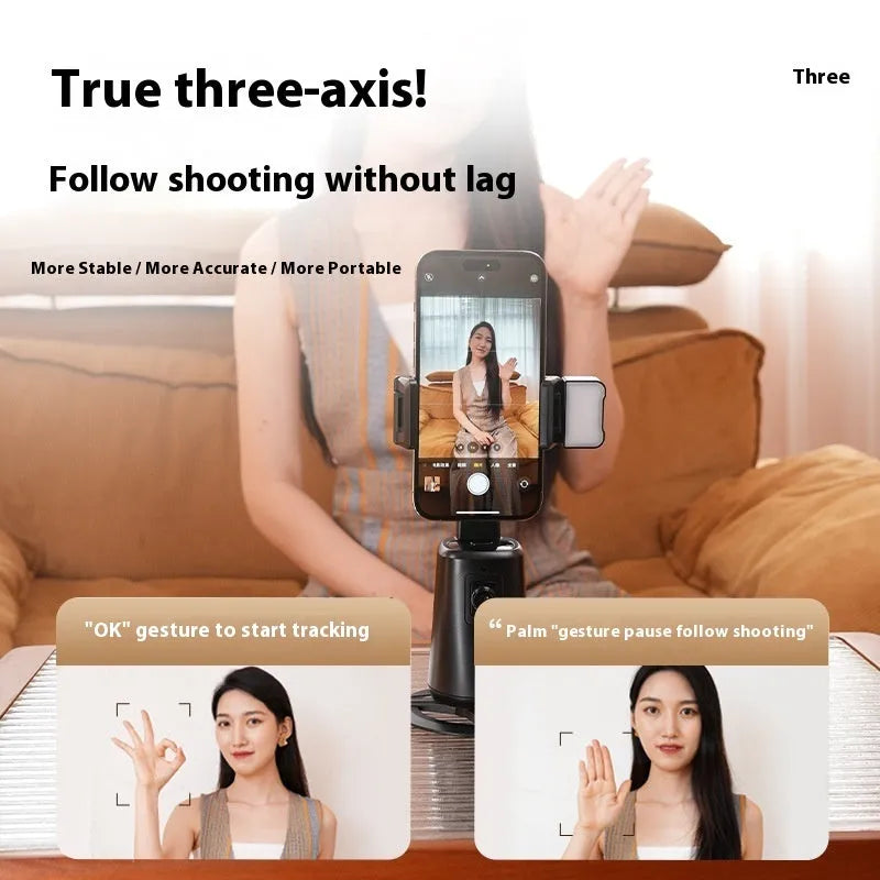 Black desktop mobile phone holder with ribbon lights and remote control for face tracking.