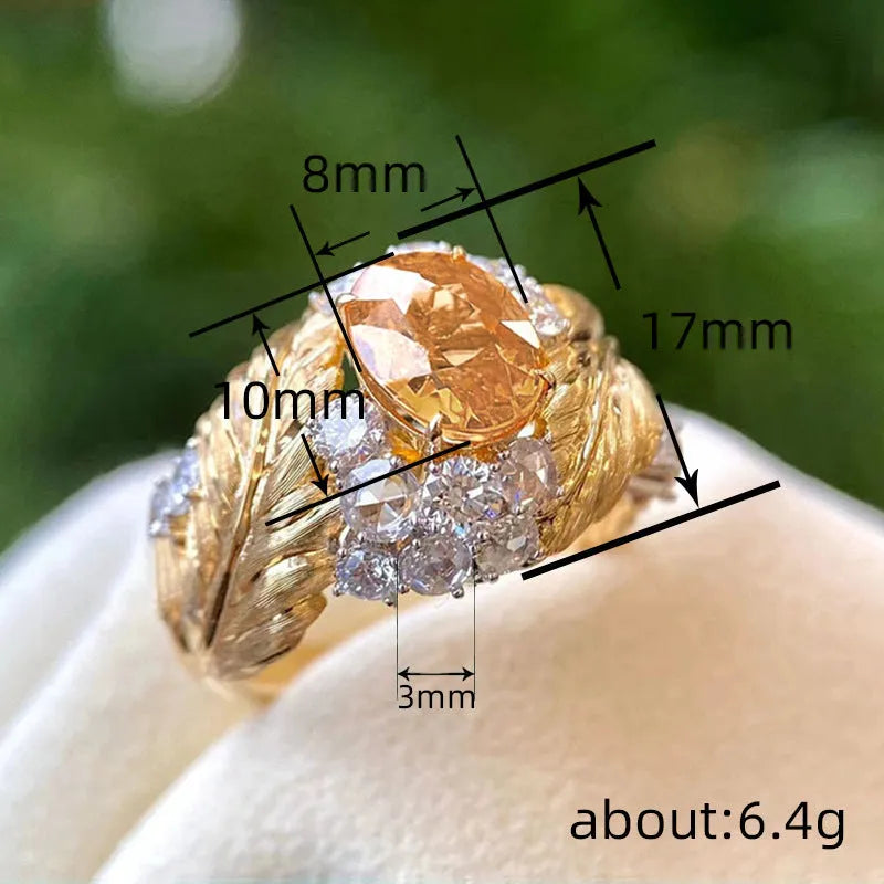 Copper women's ring with embossed feather design and yellow zircon stone in gold colour finish
