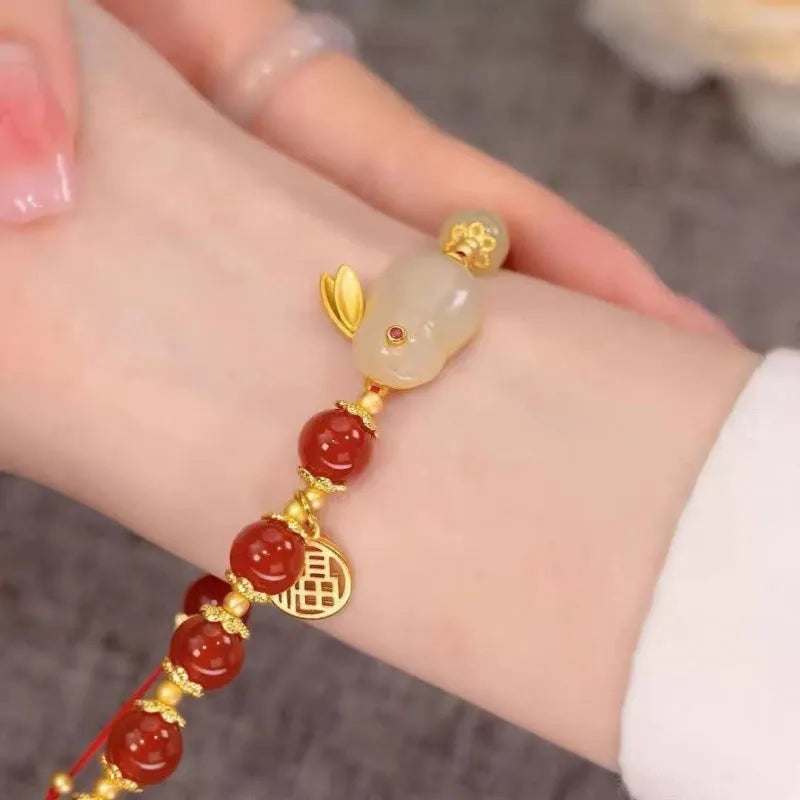 Chinese style handmade glass bead bracelet with bamboo joint elements on a white background.