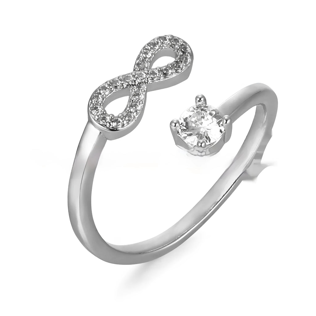 Geometric open ring with a single inlaid zircon letter on a metal band, shown in gold, rose gold, and silver finishes.